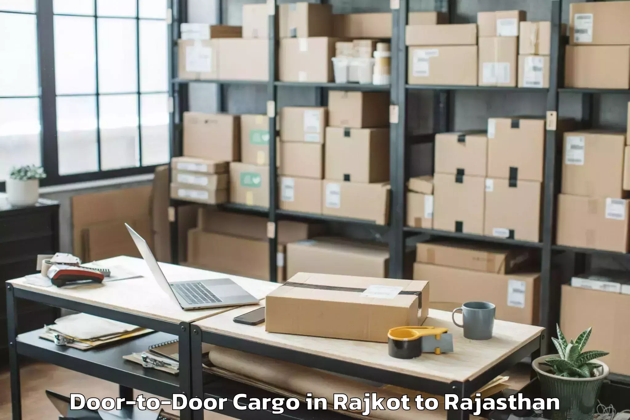 Top Rajkot to Jaipur National University Jai Door To Door Cargo Available